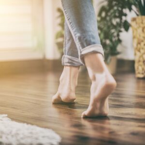 woman walking on hardwood floor